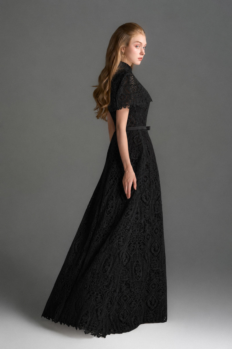 Black architectural lace bustier A-line gown with mini cape and crystal embellishments by I.H.F Studio.