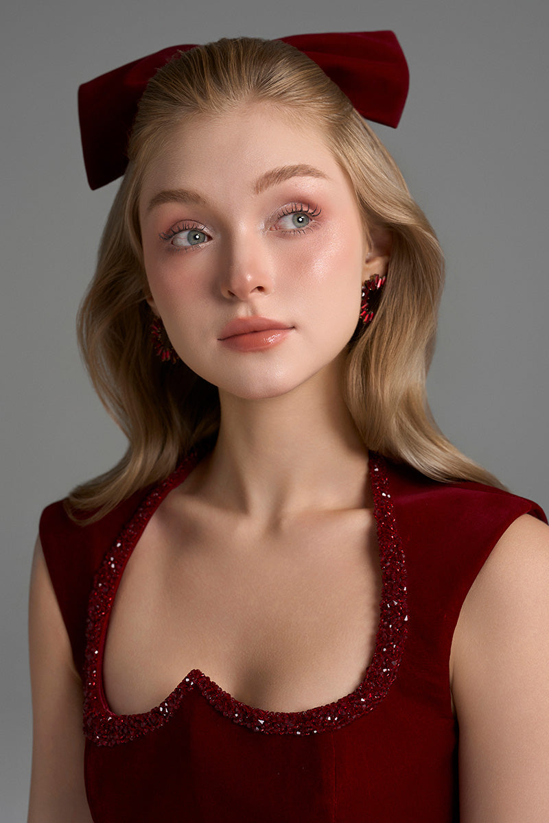 Dark red I.H.F Studio Lyon velvet midi column gown with heart-shaped neckline and crystal embellishments.