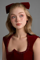 Dark red I.H.F Studio Lyon velvet midi column gown with heart-shaped neckline and crystal embellishments.