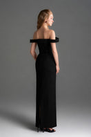 Black velvet bustier midi gown with horizontal train by I.H.F Studio, featuring a fitted silhouette and elegant design.