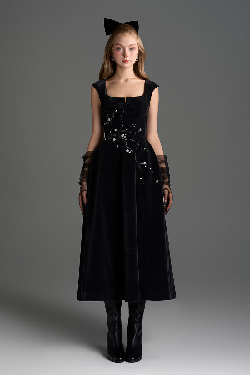 Black velvet A-line midi gown by I.H.F Studio featuring a flowing silhouette and elegant design, perfect for formal occasions.