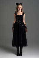 Black velvet A-line midi gown by I.H.F Studio featuring a flowing silhouette and elegant design, perfect for formal occasions.