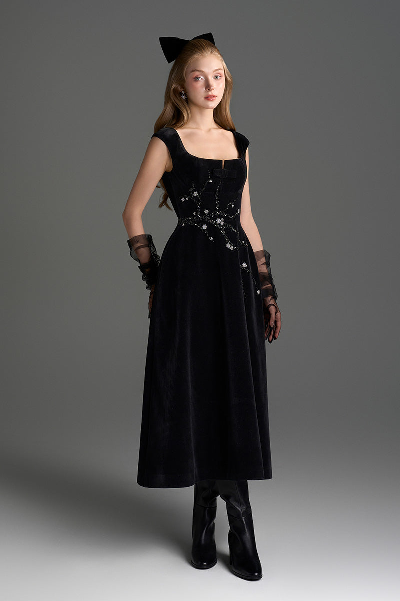 Black Lyon velvet A-line midi gown with branch detailing from I.H.F Studio, featuring a smooth, elegant silhouette.