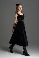 Black velvet A-line midi gown by I.H.F Studio featuring a sophisticated design with branch detailing on the dress.