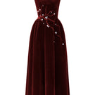Red velvet A-line midi gown by I.H.F Studio featuring a sleek silhouette and elegant design, with a branch detail on the dress.