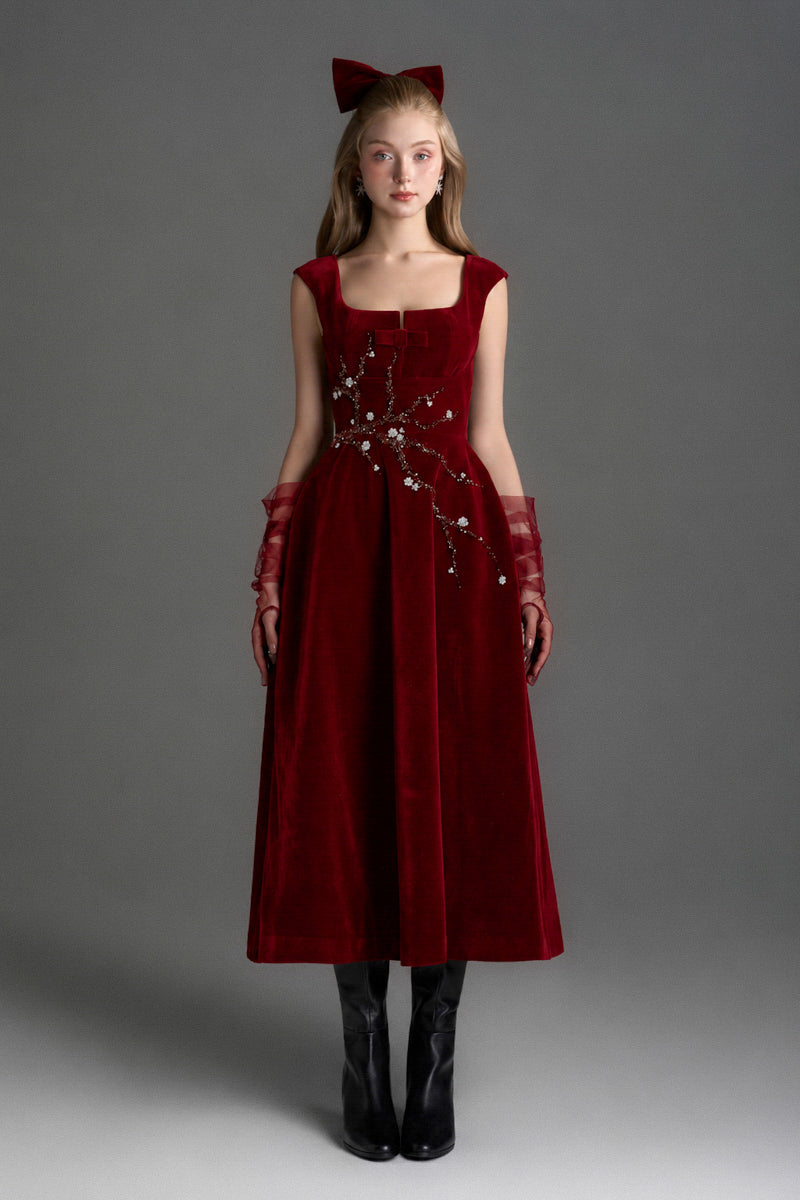 Red velvet A-line midi gown by I.H.F Studio featuring a sleek silhouette and elegant design, perfect for formal occasions.