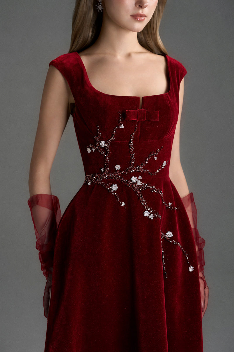 Red velvet A-line midi gown by I.H.F Studio featuring a sleek design and elegant silhouette, perfect for formal occasions.