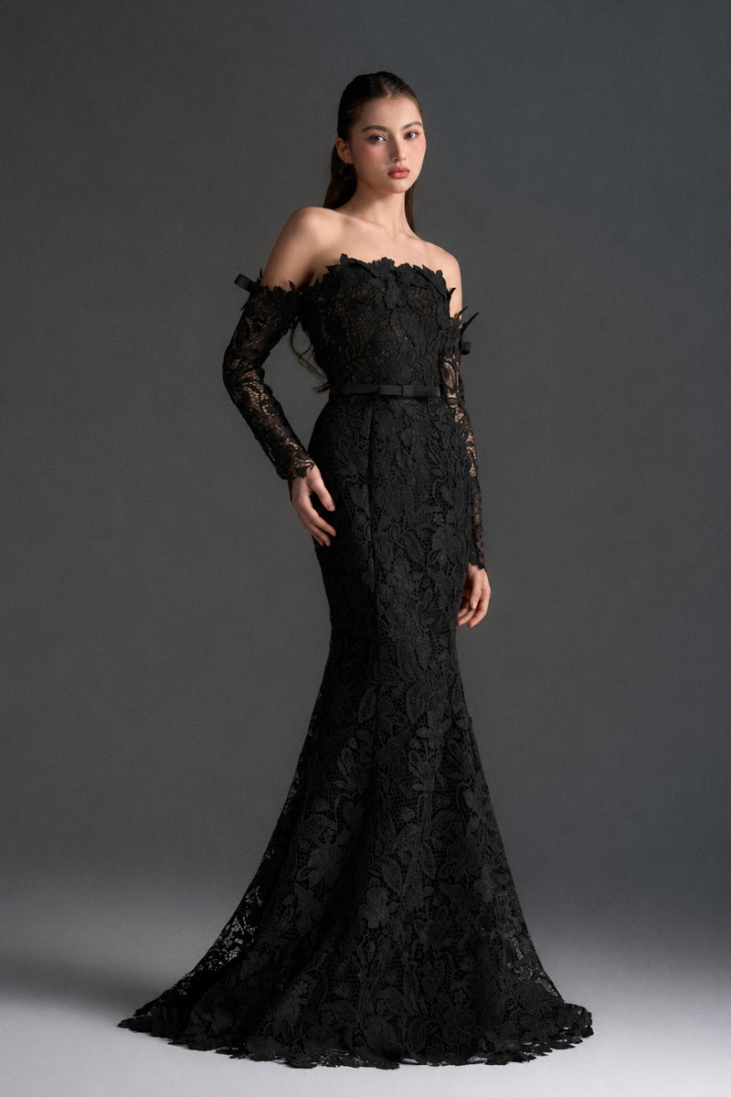 Black floral lace off-shoulder mermaid gown by I.H.F Studio with silk waist belt, elegant and fitted for special occasions.