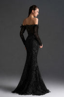 Black floral lace off-shoulder mermaid gown from I.H.F Studio with silk waist belt, detailed lace design, and elegant fit.