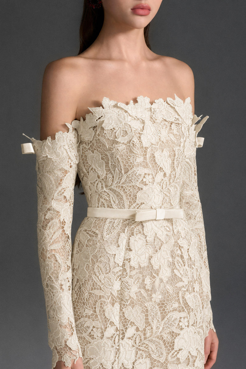 Ivory floral lace off-shoulder mermaid gown by I.H.F Studio with a silk waist belt, elegant and fitted for formal occasions.