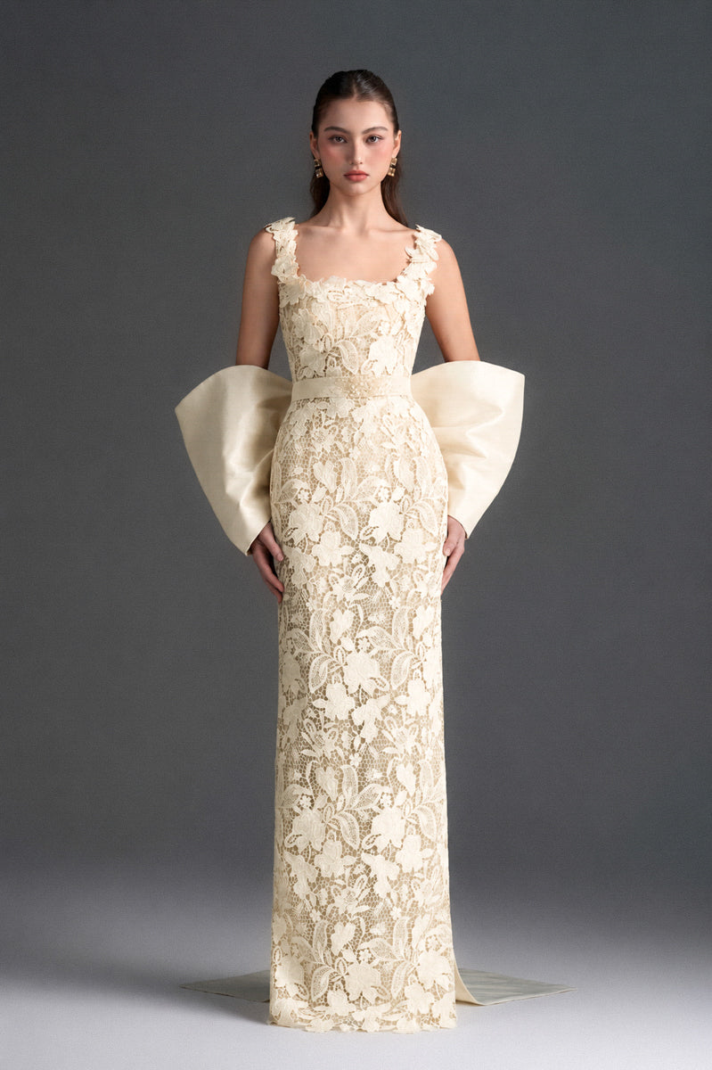Ivory floral garden lace gown with square neckline and large back bow, designed by I.H.F Studio, elegant column dress for special occasions.