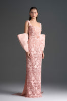 Light pink floral garden lace gown by I.H.F Studio with square neckline, column silhouette, and large back bow.