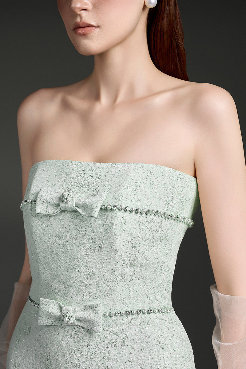 Elegant strapless lacquered brocade gown by I.H.F Studio featuring intricate patterns and a fitted silhouette.