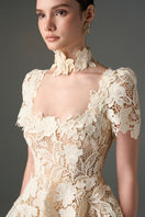 Ivory floral garden lace 3-tiered A-line gown by I.H.F Studio, featuring intricate lace details and a flowing silhouette.