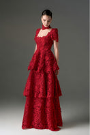 Red floral garden lace 3-tiered A-line gown by I.H.F Studio featuring intricate lace details and a flowing silhouette.