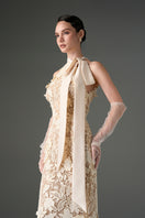 Ivory floral garden lace gown with long bow straps by I.H.F Studio, featuring intricate lace details and elegant design.