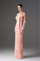 Light pink floral lace gown with long bow straps from I.H.F Studio, featuring intricate lace details and a flowing silhouette.
