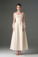 Elegant ivory silk taffeta trapeze A-line gown with crystal embellishments by I.H.F Studio, featuring a flowing silhouette and detailed accents.