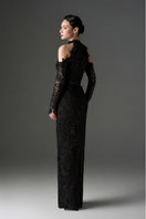 Black floral garden lace gown by I.H.F Studio featuring long sleeves and elegant design, shown on a model.