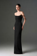 Black taffeta off-shoulder corset gown with embellishments by I.H.F Studio, featuring a fitted bodice and flowing skirt.