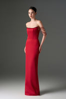 Red taffeta off-shoulder corset gown with embellishments by I.H.F Studio, featuring a fitted bodice and flowing skirt.