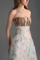 Light blue and light brown floral brocade and silk taffeta A-line gown by I.H.F Studio with clustered brown and blue floral pattern.