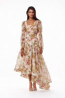 BY HAÓ AUREA asymmetric maxi dress in multi-color fabric, flowing design with elegant draping and bold pattern details.