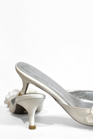 Christin Wu Camelia Cream Bloom Heels with floral design and elegant beige color, showcasing stylish high-heeled footwear.