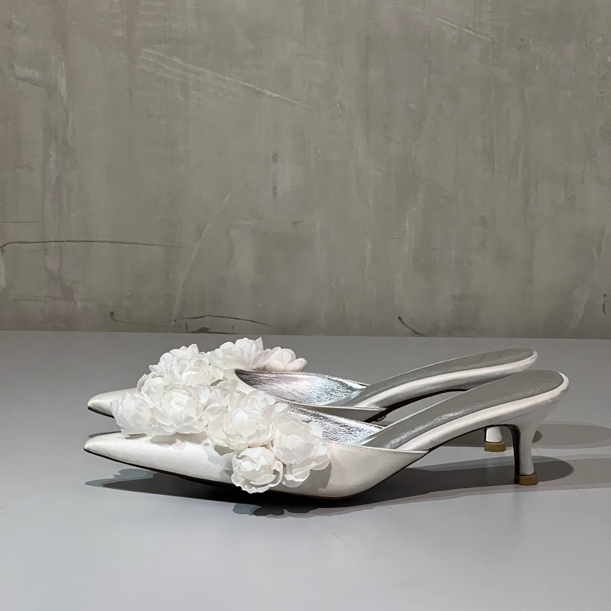 Christin Wu Camelia Cream Bloom Heels featuring elegant floral design and comfortable heel height, perfect for stylish occasions.