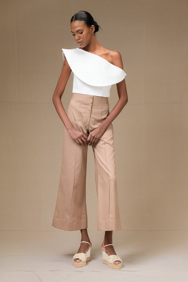 Tan PINO pants by ANA + MARIA displayed in the image, featuring a stylish, tailored design with a comfortable fit.