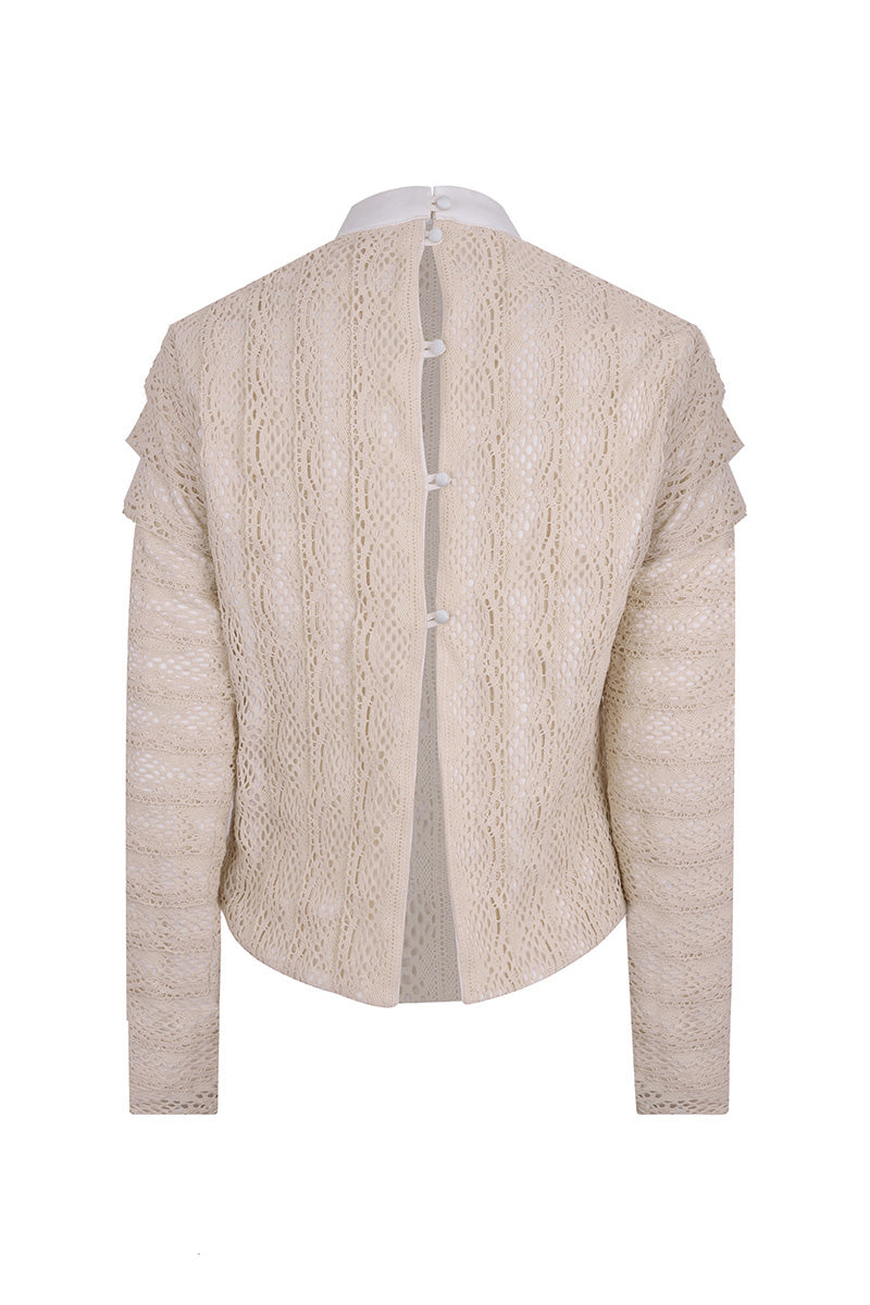 Back view of Lorena Saravia Catalina blouse, a stylish women's top with flowing fabric and elegant design.
