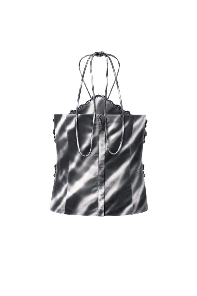 Black print Cayena top by Tinta Latina, showcasing the stylish design and fitted silhouette of this trendy women's blouse.