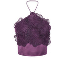 Purple printed Cayena top by Tinta Latina, showcasing stylish sleeveless design and vibrant purple floral pattern.