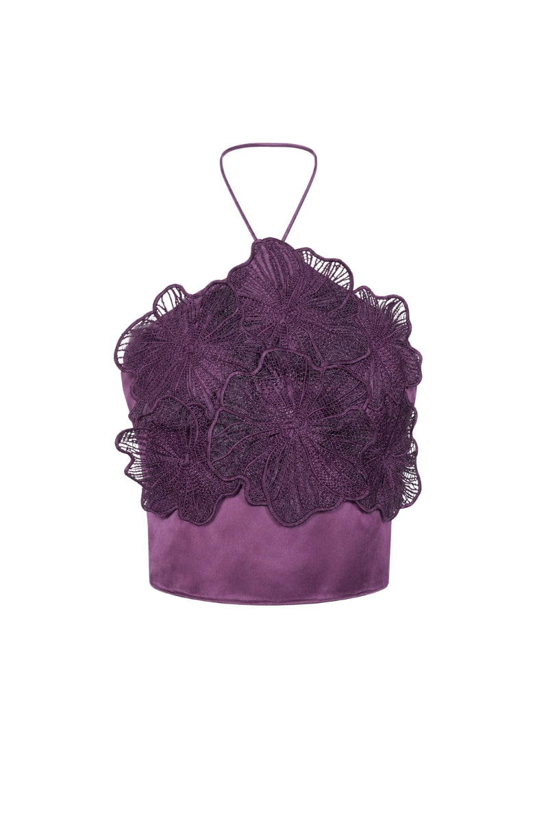 Purple printed Cayena top by Tinta Latina, showcasing stylish sleeveless design and vibrant purple floral pattern.