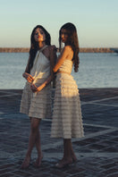Maylé Vásquez Alya skirt in nature print, a stylish mini skirt with vibrant floral design, shown on a model.