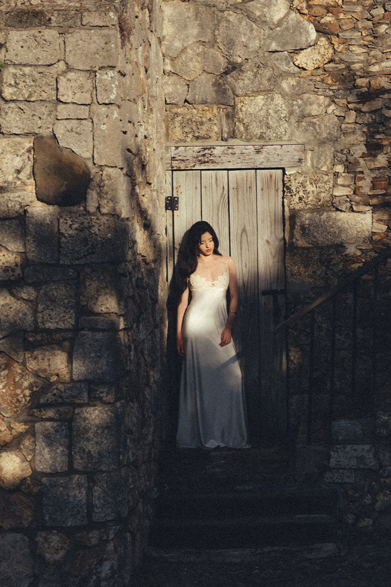 Elegant Maylé Vásquez Concha Dress gown with intricate detailing and flowing fabric, perfect for formal occasions.