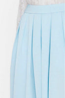 Sky blue balloon pants by Valenciani featuring a relaxed, oversized fit and lightweight fabric for comfortable style.