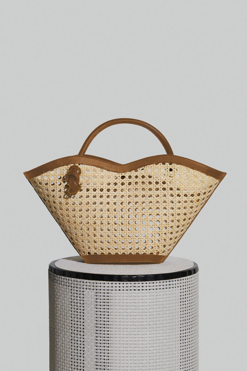 FOLKLORE THE LABEL Cella Camel top handle bag featuring a structured design and elegant handle, perfect for stylish carry.