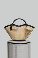 Black Cella Chair-inspired handbag by Folklore The Label, featuring top handle design and sleek, modern style.