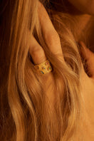 Peracas Cesare ring in multi-color design, featuring layered gold-tone rings with modern style and textured finishes.
