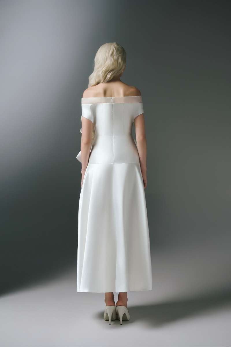 White Plan Charlotte maxi dress featuring a flowing silhouette and elegant design, ideal for casual and formal occasions.