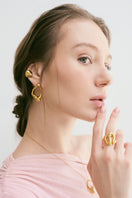 Gold Cielo ring by Eugenia Ospina, featuring a sleek, minimalist design with a polished finish and delicate band.
