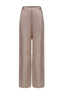 URA Marie trousers in champagne color, stylish women's pants with tailored fit, shown on a model.
