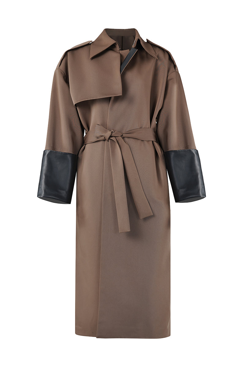 URA ADA camel coat displayed on a hanger with a classic design and warm fabric suitable for winter wear.