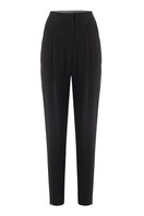 Black URA KIA pants showing a slim fit design with pockets, made from durable fabric, displayed on a plain background.