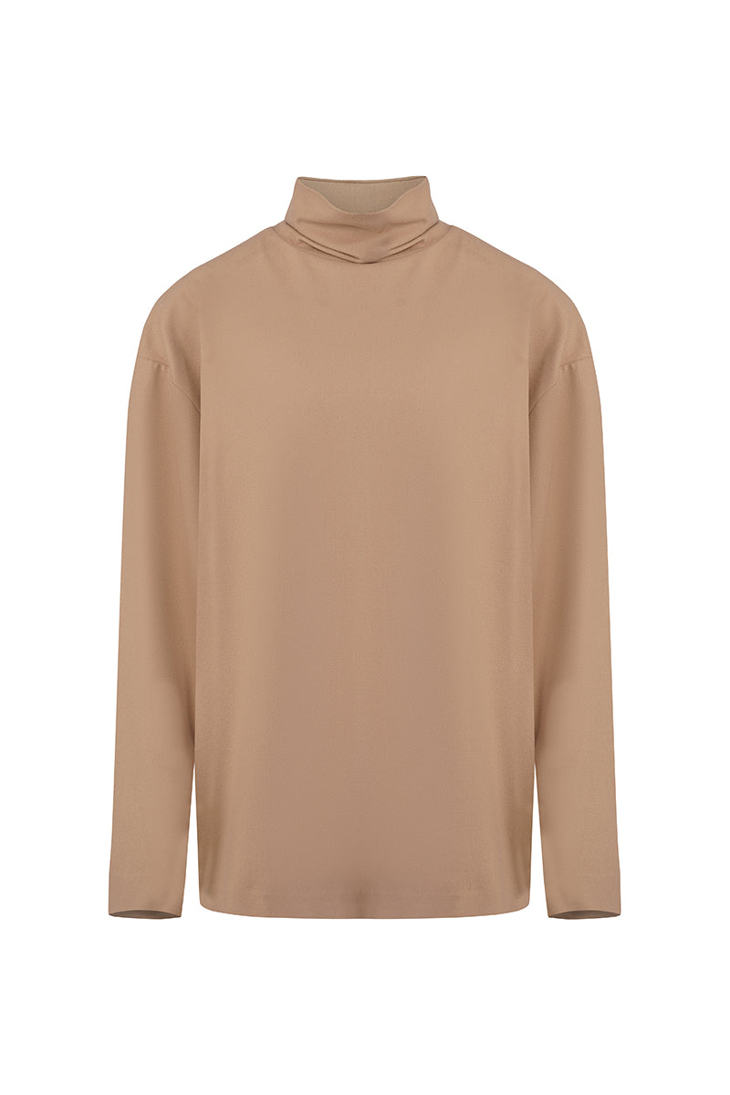 URAA EIRA top, stylish women's blouse with a relaxed fit, featuring a soft fabric and modern design, shown in a neutral color.