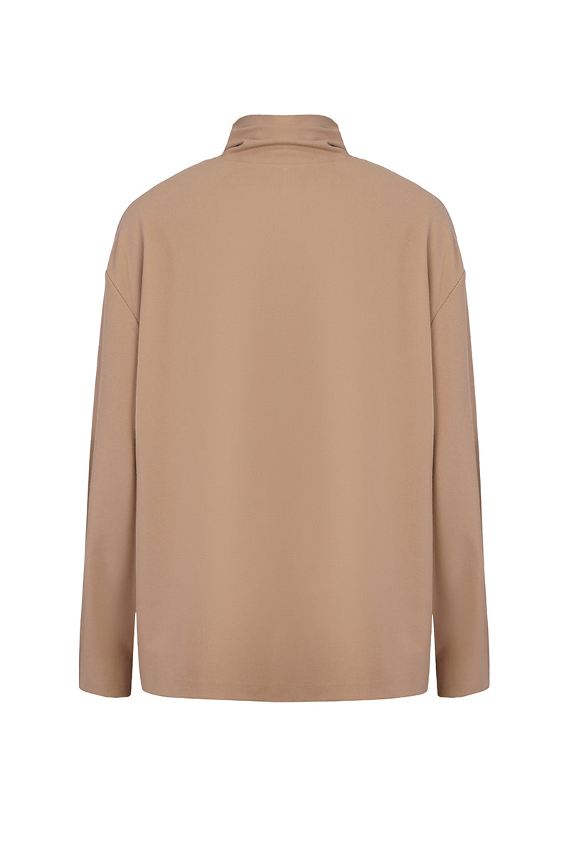 Light blue EIRA top by URA, featuring a comfortable fit and stylish design, shown in a close-up image.
