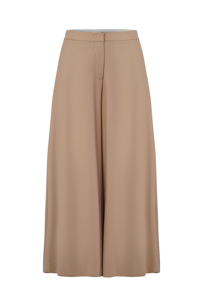 Blue EIRA trousers by URA, stylish pants with a tailored fit, shown in a close-up image highlighting the fabric and design details.