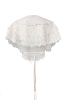 URA SISILIA top, stylish sleeveless blouse with a V-neck and ruffled details, displayed on a hanger.