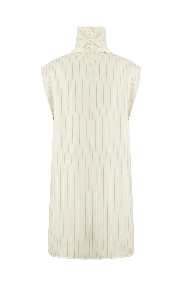 Off-white Laura top by URA, lightweight and stylish, shown on a model with a relaxed fit and soft fabric details.